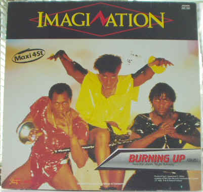 Prix estimations du Disque vinyle Maxi Single 45 tours du groupe de musique anglais Imagination - New Dimension (Electro Mix) - Burning Up (Dub) - 1983 Ariola Group Of Company - Photographie de la Pochette verso - inclus dans l'album Scandalous - Musiciens : Steve Jolley - Tony Swain - Leee John - Ashley Ingram - Disques Vinyls Remix Club Dub Tubes Electro Funk des années 80 - Vinyleticketomania
